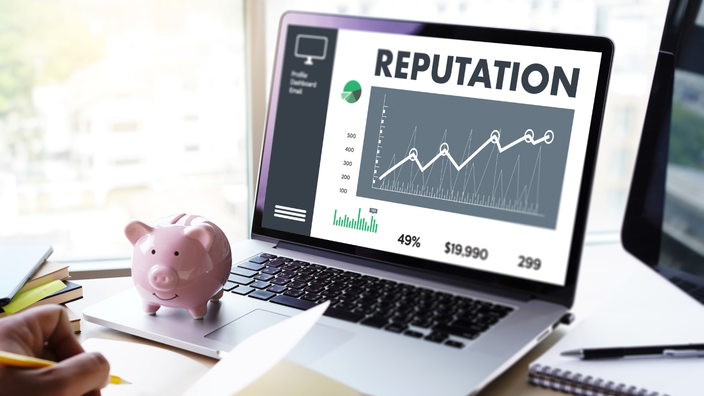 A laptop monitor displaying a line graph with an upward rate of reputation