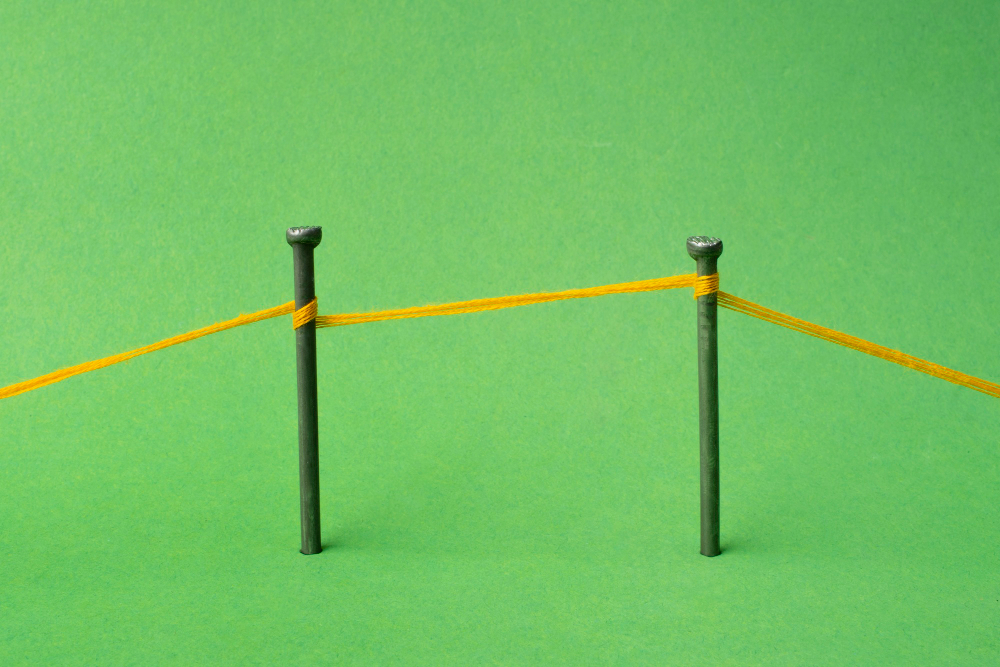 Two nails connected by a thick thread