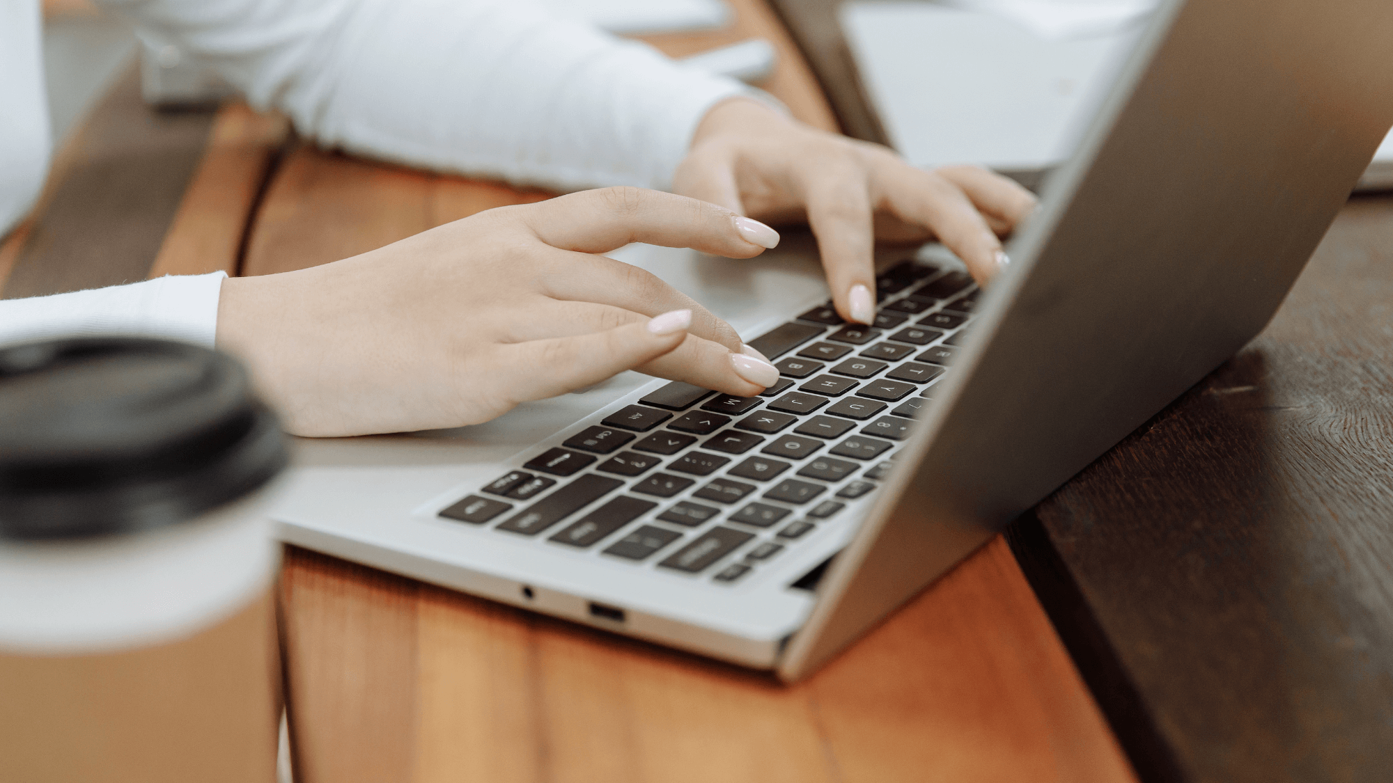 An image of a person browsing through a laptop