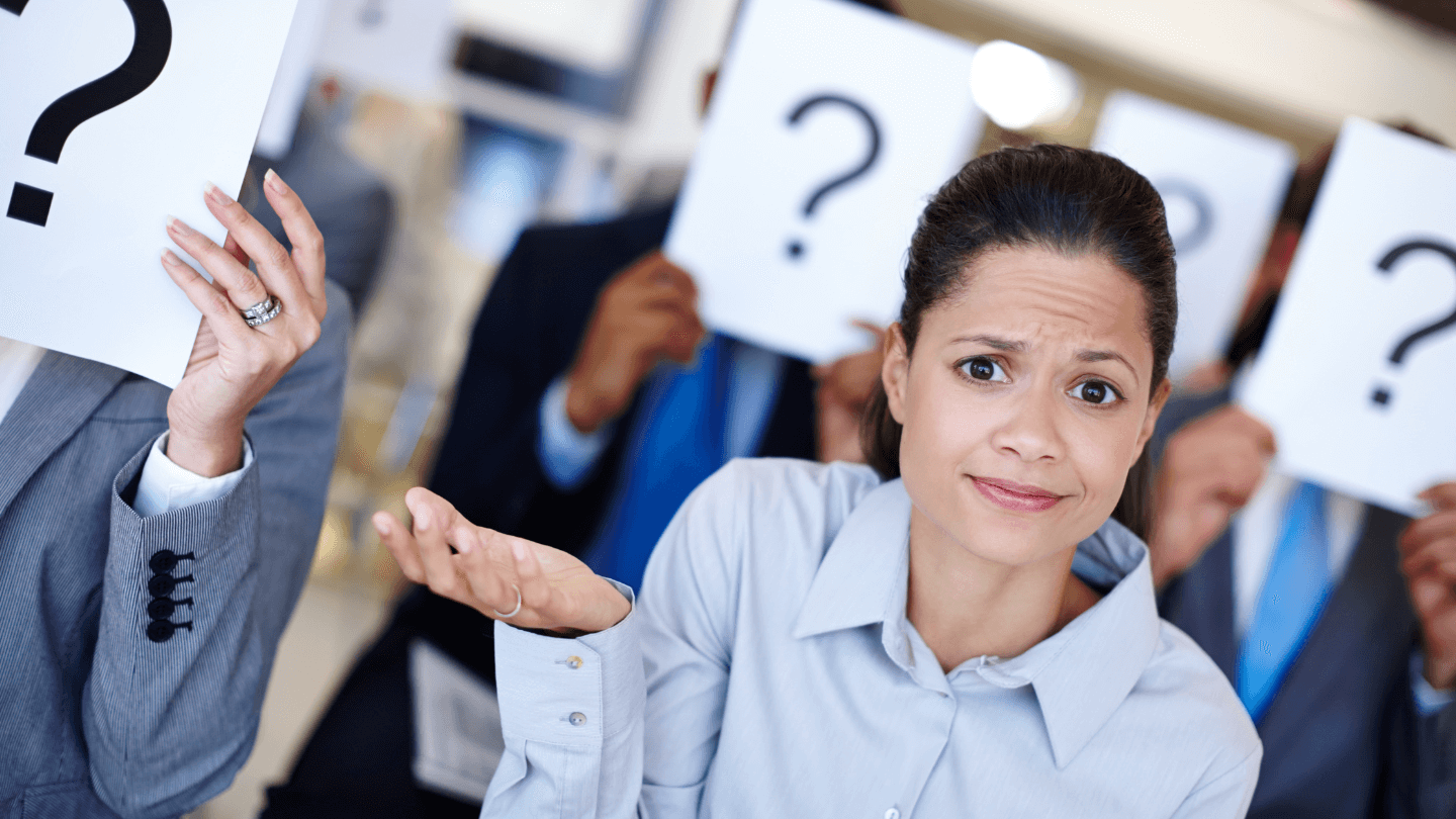 A woman looking confused with question marks in the background