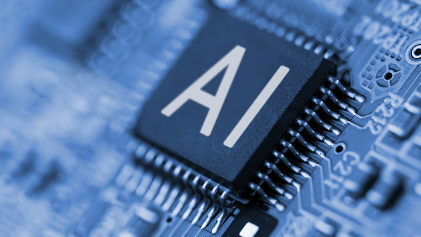A microchip with text showing AI