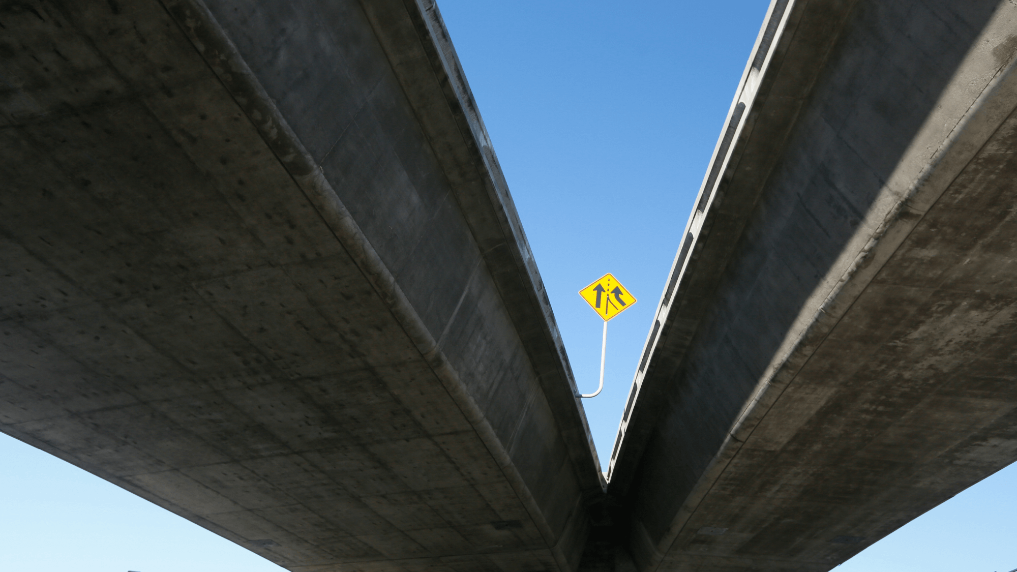 An image of a view below the highway showing the "Added Lane Signage"