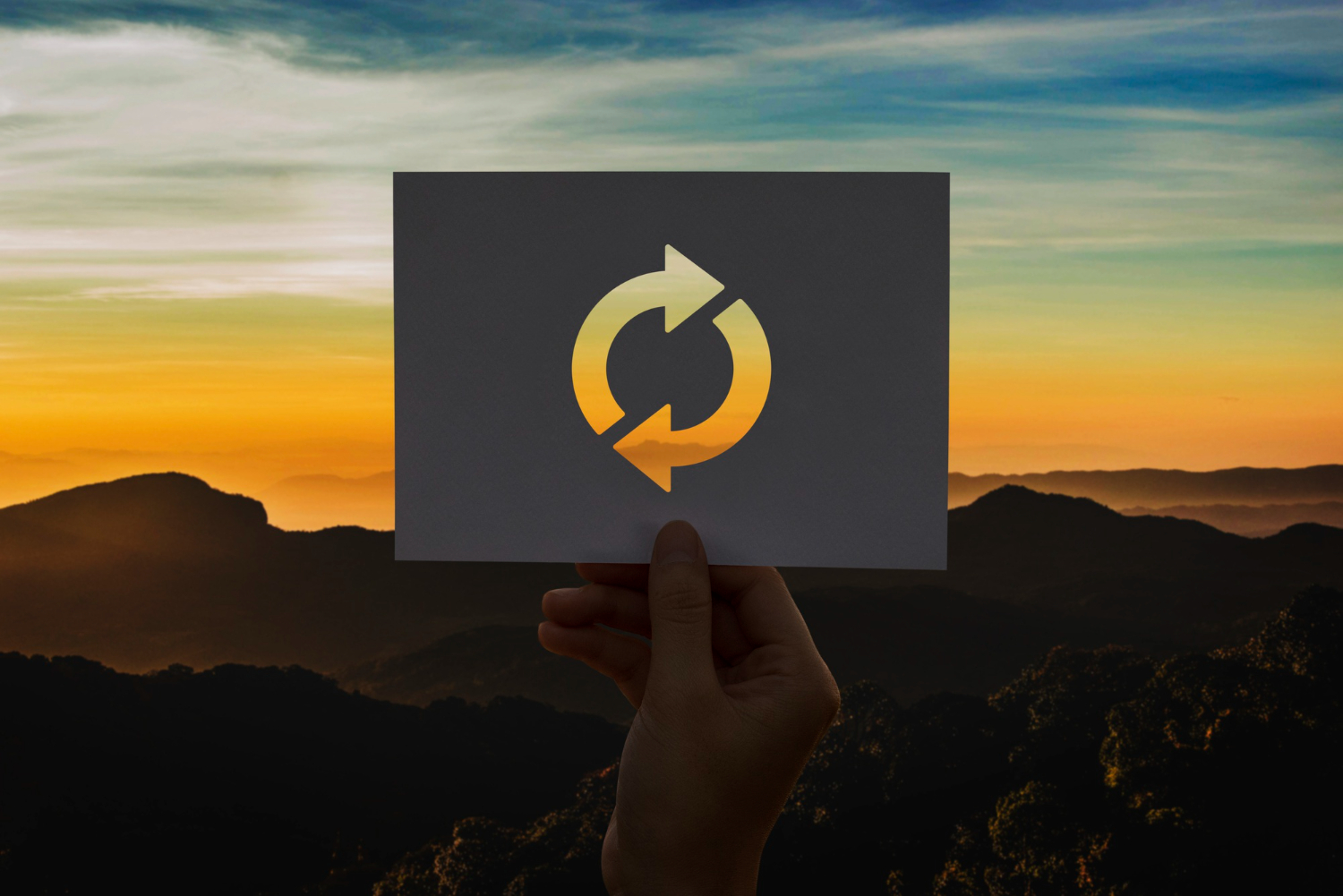 An image of a recycle icon on a piece of paper